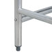 A stainless steel Advance Tabco work table with an open metal base.