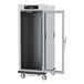 A Metro C5 9 Series holding/proofing cabinet with a clear glass door and shelves.