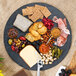 A Tablecraft Frostone melamine display tray with cheese, crackers, nuts, and fruit on a table.