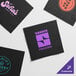 A group of black Choice customizable beverage napkins with black, orange, and purple logos.