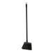A warehouse broom with black unflagged bristles and a long black handle.