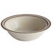 A white stoneware bowl with brown speckles and a brown rim.