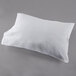 A white Oxford T300 Super Deluxe King Size pillow on a gray surface.