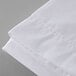 A close up of a white Oxford T300 Super Deluxe flat sheet.