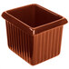 A brown rectangular Tablecraft copper server with ridges on a counter.