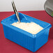 A Tablecraft sky blue rectangular server with white food inside.