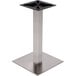 A brushed stainless steel square table base with black screws.