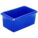 A Tablecraft cobalt blue rectangular server with ridges on a counter in a salad bar.