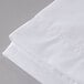 A close up of a white Oxford T300 Super Deluxe flat sheet.