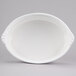 A white oval dish with a handle.