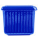 A cobalt blue rectangular cast aluminum server with ridges.