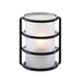 A Sterno plastic cylinder globe over a lit candle.