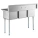 A Regency stainless steel three compartment sink on galvanized steel legs.