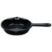 A black skillet with a handle.