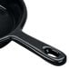 A Tablecraft black cast aluminum fry pan with a handle.