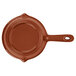 A brown cast aluminum fry pan with a handle.