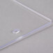 A clear plastic end panel with a white band.