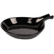 A black cast aluminum bowl with a handle.