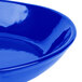 A close-up of a Tablecraft cobalt blue cast aluminum skillet.