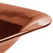 A close up of a Tablecraft copper square bowl.