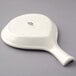 A Tuxton eggshell white china fry pan server with a handle.