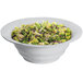 A Tablecraft natural cast aluminum salad bowl filled with lettuce and celery.