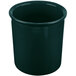 A hunter green cast aluminum bowl with a handle.