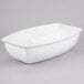 A white oval shaped Tablecraft cast aluminum bowl.