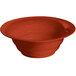 A red Tablecraft wide rim salad bowl.