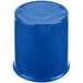 A blue cup sitting on a table.