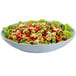 A Tablecraft gray cast aluminum pasta bowl filled with pasta and red and green tortellini.