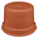 A brown plastic lid on a brown pot.