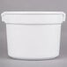 A white Tablecraft cast aluminum bain marie soup bowl with a handle.