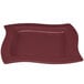 A maroon rectangular Tablecraft metal serving platter with a wavy edge.