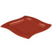 A red square Tablecraft copper cast aluminum platter with a curved edge.