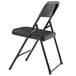 A National Public Seating black metal folding chair with a black plastic seat.