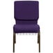 A close-up of a Flash Furniture Royal Purple church chair with a gold vein metal frame and a communion cup book rack.