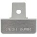 A close-up of a metal plate with the word "push" on it.