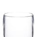 A close-up of a clear Thunder Group plastic pilsner glass.