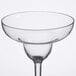 A clear plastic margarita glass with a rim.