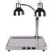 An Alto-Shaam stainless steel dual lamp carving station on a counter.