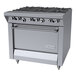 A stainless steel commercial range with six burners and a standard oven, designed for professional kitchens.