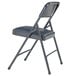 A black metal folding chair with a dark midnight blue vinyl padded seat.