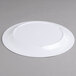 A white Carlisle Sierrus melamine plate on a gray surface.