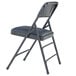 A black metal folding chair with a dark midnight blue cushion.