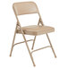 A National Public Seating beige metal folding chair with a French beige padded seat.