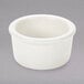 A Tuxton eggshell white ramekin.