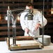 A chef cutting meat on an Alto-Shaam heated carving station.