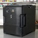 A black Cambro Ultra Pan Carrier sitting on a counter.