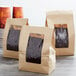 A group of brown Choice paper bags with coffee beans in them.